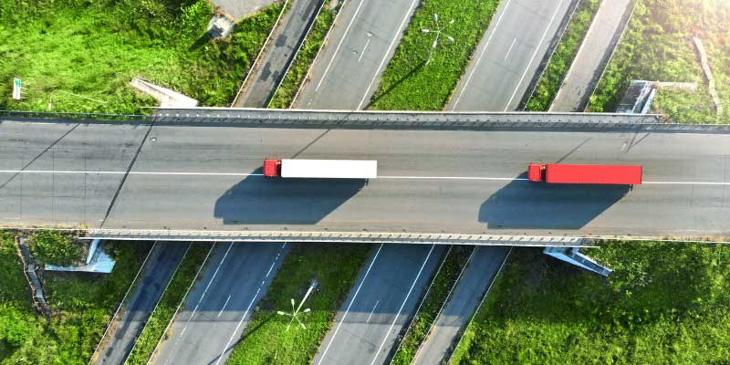 aerial view of transportation trucks on highway